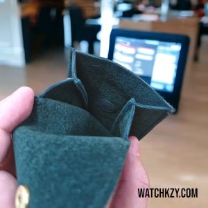 Travel pouch for watch button production